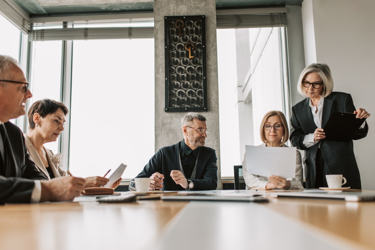 A business meeting where a team is working to solve a complex problem.