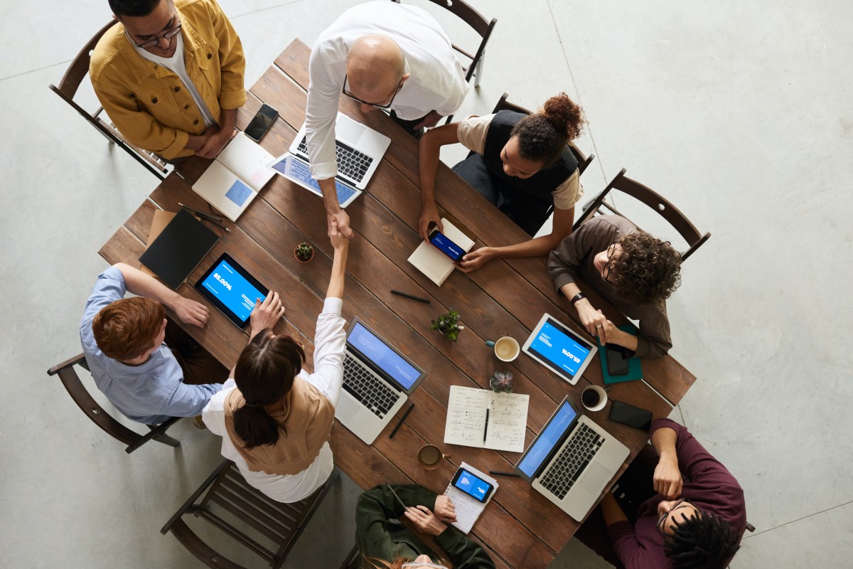 A business team working on a desk.