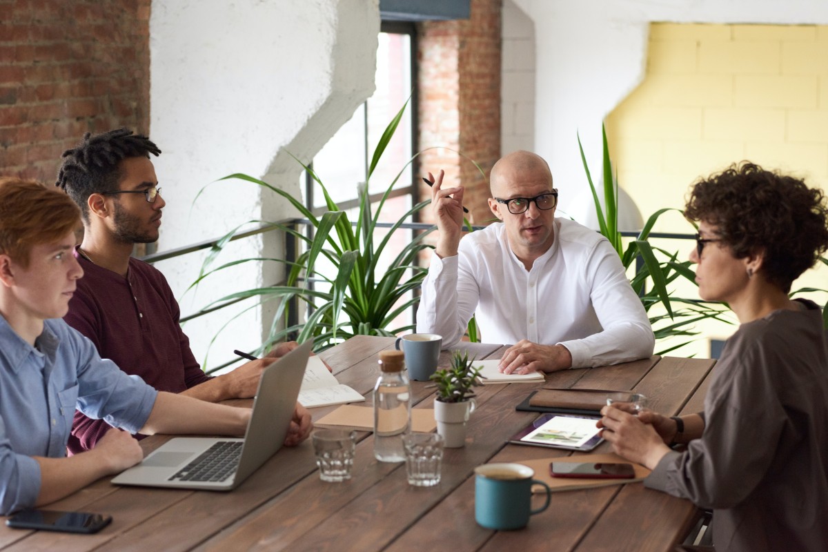 A business team working on a desk.